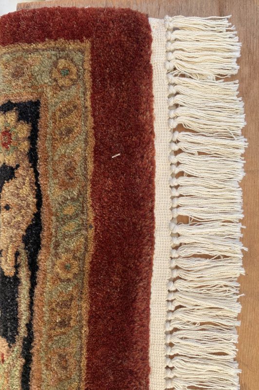 Elegant Zeytounian rug featuring intricate patterns and rich colors, perfect for enhancing any livin.